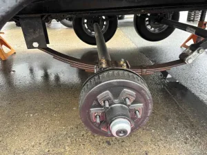 1. Remove the wheels to determine that the axles are mounted under the springs.