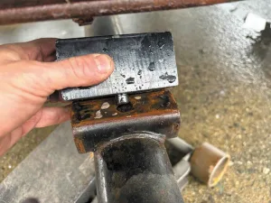 5. Position the spacer so that the pin inserts into the hole on the axle saddle.