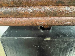 6. Elevate the axle so the spring pin fits into the spacer hole.